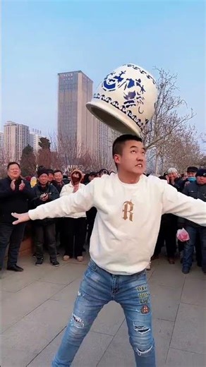 The acrobatic jar-balancing act went awry in front of so many people, but the audience still cheered