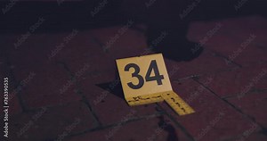 Evidence marker, hand of csi and crime scene with forensic on floor at night for investigation of murder. Professional, expert in gloves and case investigator with observation and search with blood