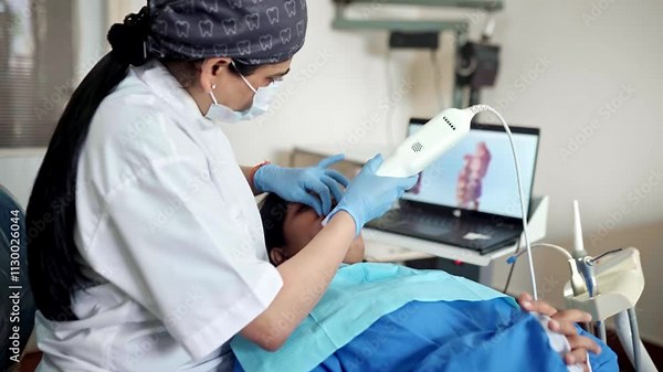 Dentist Using an Intraoral Scanner for a 3D Model of the Mouth