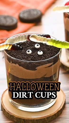 These Halloween dirt cups are filled with chocolate pudding, Cool Whip, crushed Oreos, spooky candies, and creepy crawlies. They’re the perfect little Halloween party dessert for both kids and adults! 🎃 #halloweendirtcups #DirtCups #halloweenfoodideas 🔗 https://amandascookin.com/halloween-dirt-cups/ | Things I Love
