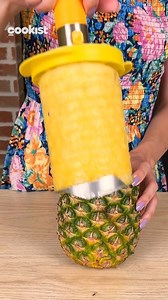 Here's a very simple way to cut a pineapple and create a delicious fruit basket! Cut the top off of the pineapple. Hollow out the pineapple completely and fill it with fruit pieces. We used a pineapple opener that you can find on Amazon by searching for Stainless Steel Pineapple Cutter | Cookist Wow