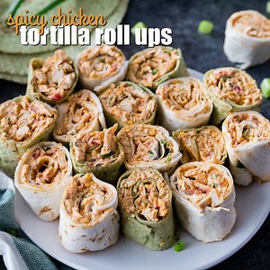 SPICY CHICKEN TORTILLA ROLL UPS are full of amazing flavors perfect for any party! These easy chicken pinwheels can be made ahead of time & served up later, so they'd be perfect for New Year's!! RECIPE--> https://realhousemoms.com/spicy-chicken-tortilla-roll-ups/ | Real Housemoms