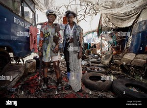 Nairobi, Kenya. 10th Jan, 2022. Two actresses dressed in post-apocalyptic costumes pose alongside each other during a film production of a music video. Artists from Kibera dressed up in post-apocalyptic costumes to shoot a music video focusing on finding solutions to the post-consumer textile wastes directed by Stephen Okoth, a local filmmaker from Kibera, Nairobi. (Photo by Donwilson Odhiamb/SOPA Images/Sipa USA) Credit: Sipa USA/Alamy Live News Stock Photo - Alamy