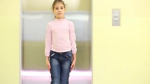 Girl Stands Front Elevator Turns Around Stock Footage Video (100% Royalty-free) 14922181 | Shutterstock