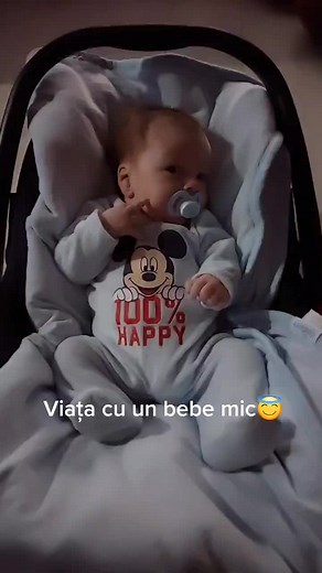 Adorable Baby in Mickey Mouse Onesie Smiles Happily