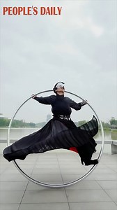 When the Waltz meets traditional Chinese dance, the cyr wheel dance gets its oriental glamor. | People's Daily, China