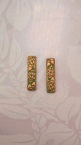 This technique of adding mica powder to the raised parts of a design is definitely one of my favorites! I really like Kato Liquid Clay as my sealer. It’s super shiny when you cure it with a heat gun, and it stays nice and flexible for huggies! If you try this technique, be careful not turn burn yourself or your clay with that heat gun! Definitely practice before trying it on a pair of earrings. 😬 #huggiehoops #autumnvibes #fallearrings | The Clay Impress