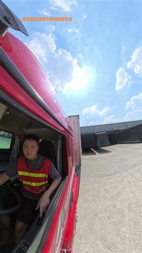 See young man 00s major reversing semi-trailer in SF delivery center