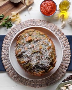 This easy-to-make, yet impressive garlic bread is hard not to love. In this recipe, forty cloves of garlic are drizzled with olive oil, salt and pepper, and roasted until they’re soft and sweet. Then, mashed and mixed with softened butter and herbs. A sourdough bread boule is cross-hatched and then stuffed with mozzarella cheese, and lathered with our garlicky compound butter. Serve it up with some marinara sauce, or eat as is! See and shop the recipe: https://tasty.co/recipe/40-clove-garlic-bre