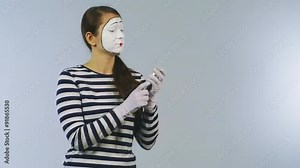 Funny mime girl writes SMS works with your smartphone