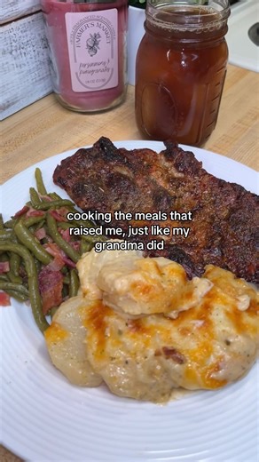 Pork steak, cheesy scalloped potatoes, and green beans :) Scalloped Potatoes: In a pan over medium-high heat, melt ½ stick of butter. Add 1 tablespoon of flour and stir for about 1 minute. Slowly pour in 1 cup of milk and 1 cup of heavy cream, stirring until smooth. Add garlic powder, onion powder, salt, pepper, oregano, and paprika. Let it cook until it starts to thicken. Stir in a handful of mozzarella and a handful of cheddar cheese until melted and creamy. Add diced, peeled potatoes to an ov