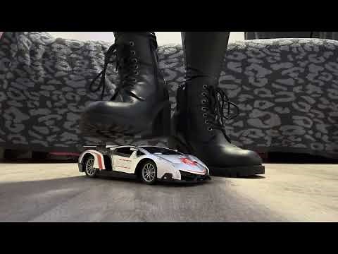 Crushing a toy car in high heel boots.