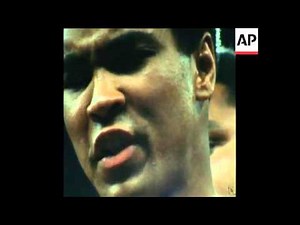 SYND 28 9 75 ALI AND FRAZIER WEIGH IN BEFORE THE BOXING MATCH IN MANILA