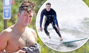Colin Jost strips off to go surfing after low Emmys viewing figures