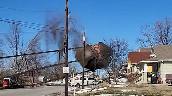 Water tower nearly crushes house in bungled demolition