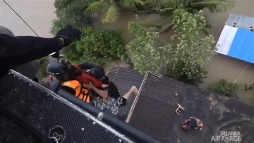 Sri Lanka Air Force Bell 212 helicopter rescued three people trapped on the top of a two-storey building in Mahawa due to flooding | Newswire