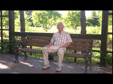 stock footage old man sitting on bench elderly guy with thoughtful face