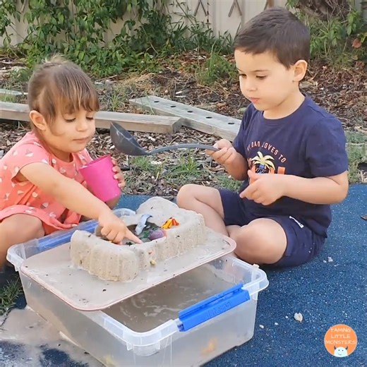 Frozen Sand Sensory Bin for Kids This is a fun and easy sensory activity to try this Summer. I've done it year after year with my two kids and they never fail to have fun. Instructions: 1. Fill a small tub with sand. 2. Hide some waterproof toys inside the sand. 3. Add in some water. 4. Freeze over night. 5. Tip the now frozen sand onto a cookie sheet. 6. Fill a large tub with water. 7. Enjoy playing. Use the water from the large tub to melt the frozen sand on the cookie sheet. As the sand melts