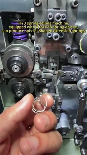 The spring coiling machine, equipped with a torsion spring device, can #factory #machine