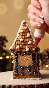 Decorating a gingerbread house with royal icing 🎄 Merry Christmas! #holidaybaking #christmascookies