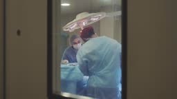 Team work with doctors, surgeons performing surgery on sick patient...