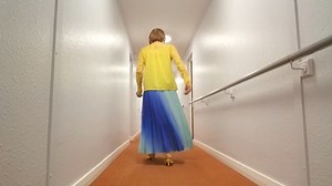 Jamie Bond Strutting In Her Aquamarine Accordion Pleated Maxi Skirt.