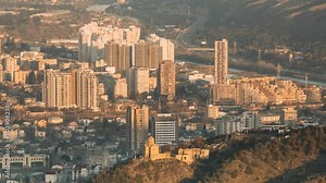 Tbilisi Georgia. Residential Quarters time lapse timelapse. time lapse timelapse elevated view Cityscape Famous Landmark Tabor Monastery In spring Evening sunset .