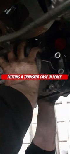 Put the transfer case in place