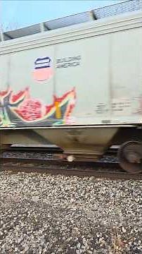 CN 3119, 2816 Westbound train with AIM gondolas, CMO/UP hopper, CN wheel flat car at Vicksburg, MI