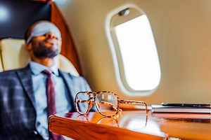 How to Actually Get Some Sleep While Traveling, According to Experts