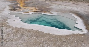blue hot spring pool, called Heart Spring, in Upper Geyser Basin, Yellowstone National Park