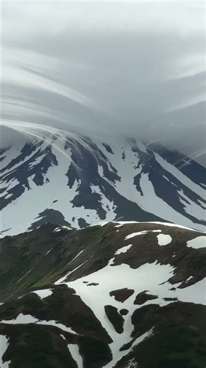 Rare lenticular cloud forms above volcano in Kamchatka Peninsula, Russia
