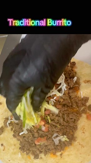Traditional Burrito in the making ! Layer of refried beans, rice, choice of meat(steak pictured here), cheese, pico de gallo and lettuce wrapped inside a warm 12” flour tortilla. Everything in our menu is tasty, this is certainly not the exception! Call in your togo order 734-317-7060 or come in and order to go or dine in, we’re glad your able to top by! #whatataco #lunapiereats #lunapier #traditionalburrito #burrito #pesopluma | What-A-Taco Mexican Restaurant