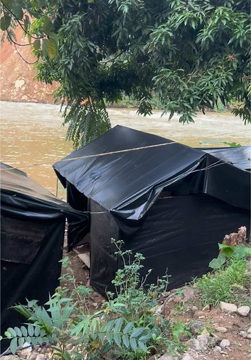 Exploring Makeshift Shelters by the Riverbank