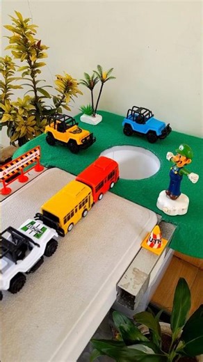 Jcb big car pushing yellow bus and red bus in pit