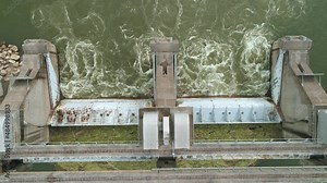 Aerial Footage of Ohio River Lock and Dam system between Indiana and Kentucky.