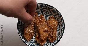 An inviting tableau of chebakia, where every piece beckons with its golden glow and delectable allure