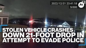 28K views · 702 reactions | GETAWAY GAFFE: Driver of a stolen vehicle sends it crashing through a fence and down a 21-foot drop in an attempt to evade police officers. A bystander below had a lucky escape but the driver and passenger were apprehended. https://abcn.ws/2Mp6pHp | ABC News | Facebook