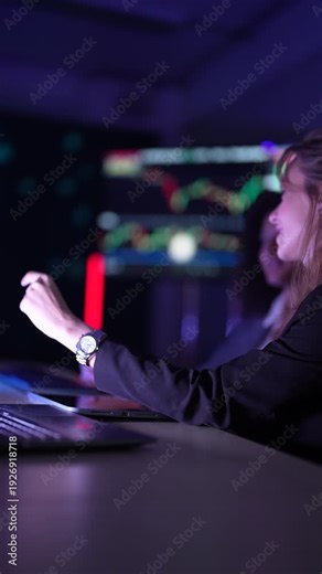 Cybersecurity analysts monitoring real-time network threat logs in dark security operations center. Digital forensic experts auditing malware code syntax during late night shift.