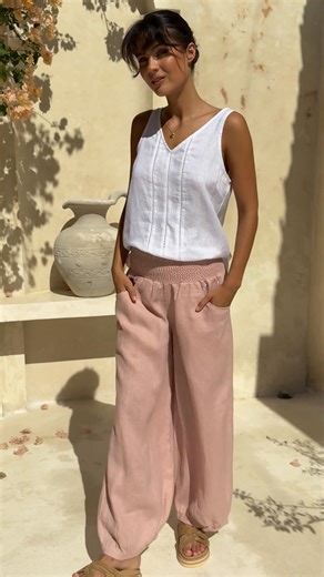 The pants that have earned over 1,000 five-star reviews from real women are finally restocked. Thoughtfully designed with an elasticated, smocked waistband that adapts to your body throughout the day. The relaxed fit moves with you while maintaining its shape, wash after wash. Available in carefully curated earthy tones that complement any wardrobe. Each pair is crafted for women who value both comfort and quality in their everyday wear. These aren't just pants. They're the piece you'll reach fo