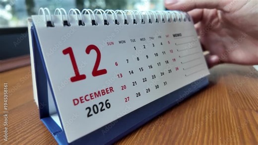 Slow motion footage of flip calendar pages for change months from november to december of the year 2026. concept of planning and starting a new month. 4k horizontal.