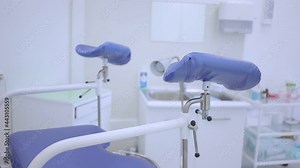 Blue gynecological chair in the women's health clinic. Close-up of an examination chair for pregnant women. The gynecologist's office is slow moving. Doctor's examination of pregnant women