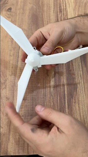 Making a wind turbine and generating electricity with a stepper motor from a scrap yard