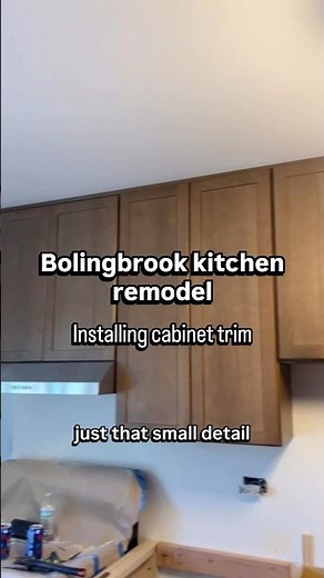 Installing cabinet trim. Bolingbrook kitchen remodel.