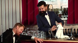 Barman working in pub. Drunk man. Guy with alcohol addiction. Man sitting at bar. Drunk relaxing at pub. Client of pub sleeping and lying with his head on table.