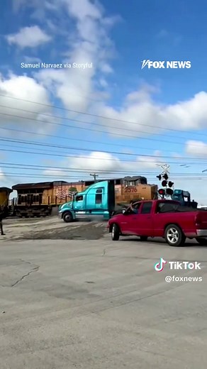 A semi-truck gets stuck on the tracks—and the train is already coming. Video shows the driver scrambling out of the cab seconds before a freight train crashes into the trailer. The truck was weighed down by equipment and couldn’t clear the crossing in time. Authorities say no one was hurt.