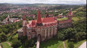 Dramatic aerial of Castelul Corvinilor, Corvin Castle. A beautiful fairytale castle in Romania.