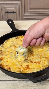 Looking for the ultimate party dip? This Three Cheese Smoked Spinach Artichoke Dip is rich, creamy, and loaded with melty cheese. | Ninjacue