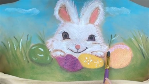 Makeup artist outdoes herself by painting a gorgeous Easter Bunny  on her body