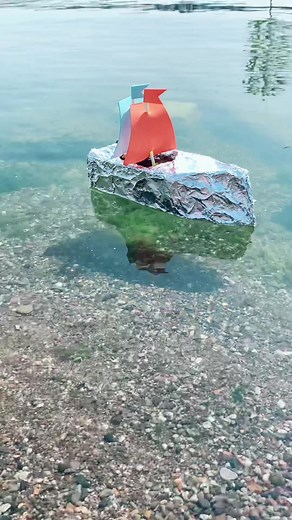 Explore the waterways in an aluminum foil boat crafted from a tissue box! A great summer time activity! #LearningThroughPlay #KidActivities #PlayAndLearn #LittleExplorers #SummerFun #summeractivities #SummerArtAdventures #